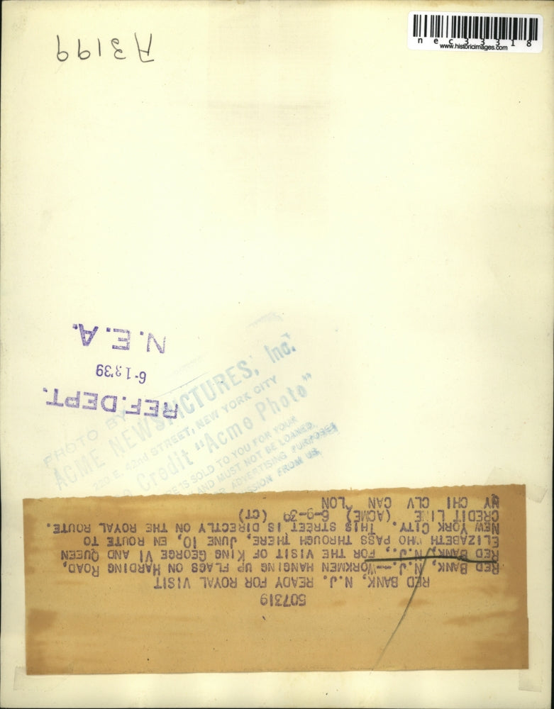 1939 Workmen hanging up the flags getting ready for the Royal Visit.