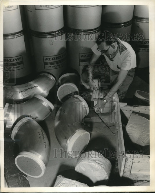 1960 Press Photo 205 pound stainless steel elbows made by Flowline Corp