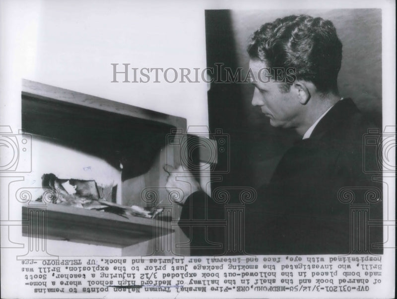 Load image into Gallery viewer, 1958 Press Photo Fire Marshall Thurman Nelson home made bomb in school book
