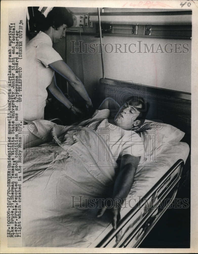 Load image into Gallery viewer, 1970 Press Photo Unidentified Nurse Comforts Airplane Crash Survivor Mike Bruce
