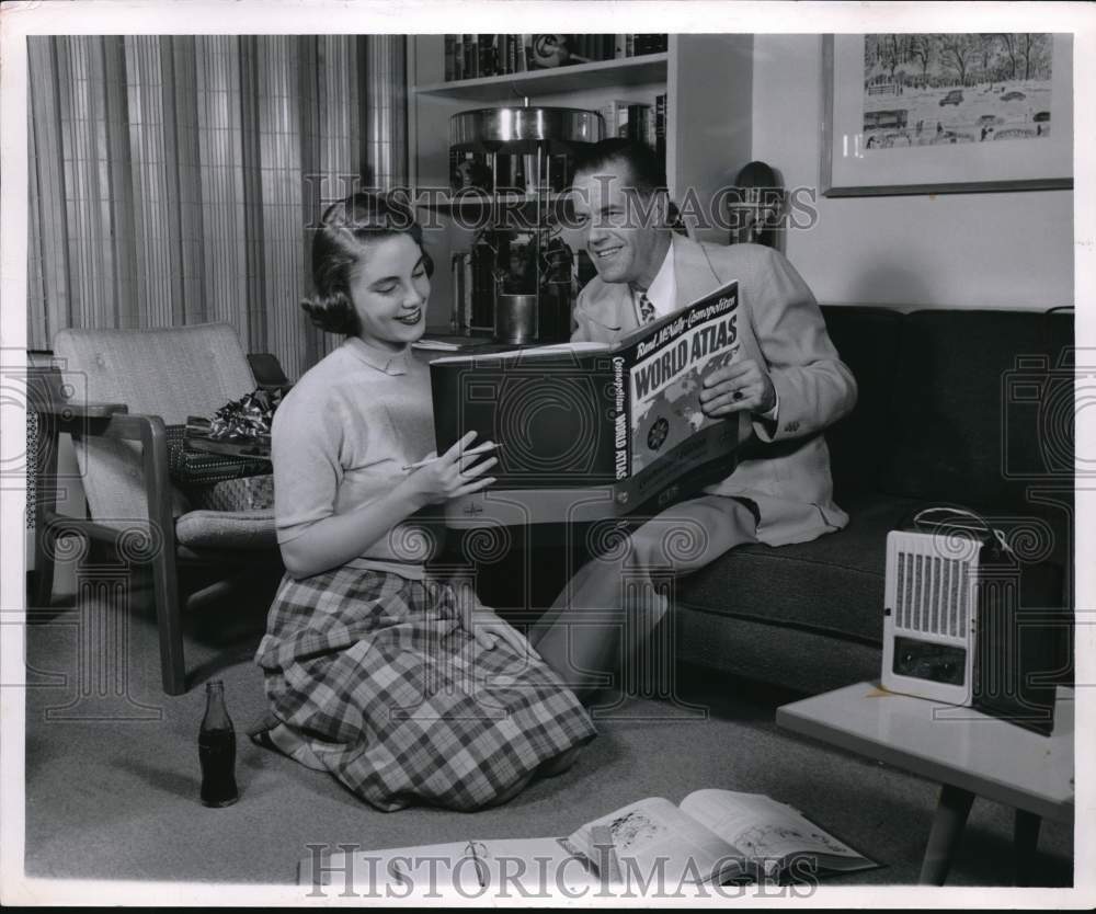 1955 Press Photo Couple reads the World Atlas together- Historic Images