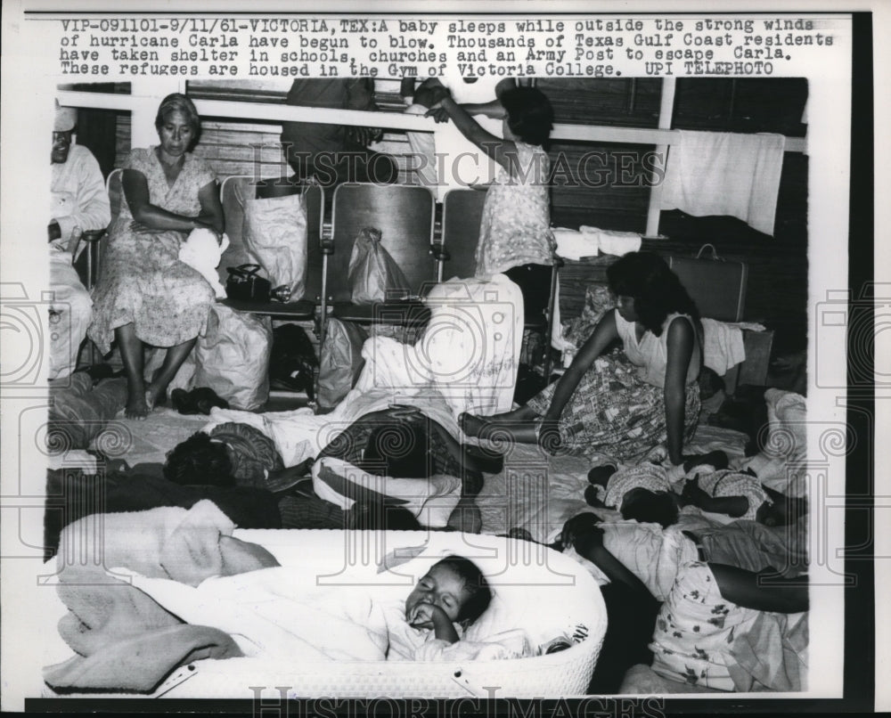 1961 Press Photo A baby sleeping during a hurricane began to blow in Texas.