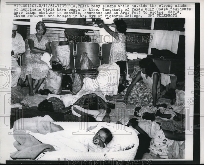 Load image into Gallery viewer, 1961 Press Photo A baby sleeping during a hurricane began to blow in Texas.
