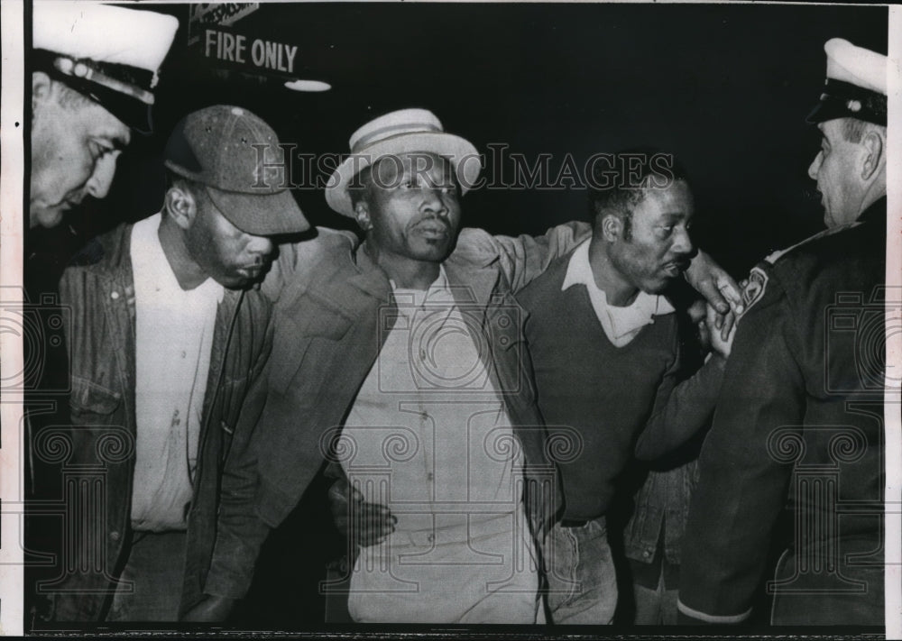 1962 Press Photo Robert L. James helped to an ambulance after being wounded.