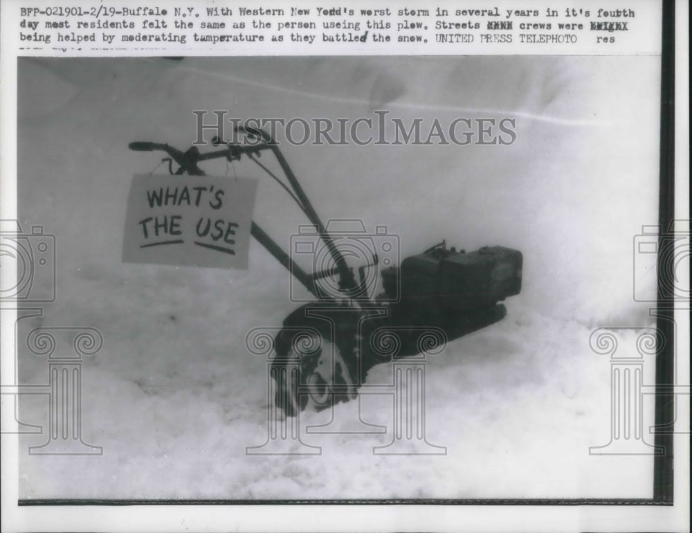 1958 Press Photo Snow plow w/ a sign of What's the USe almost covered in snow