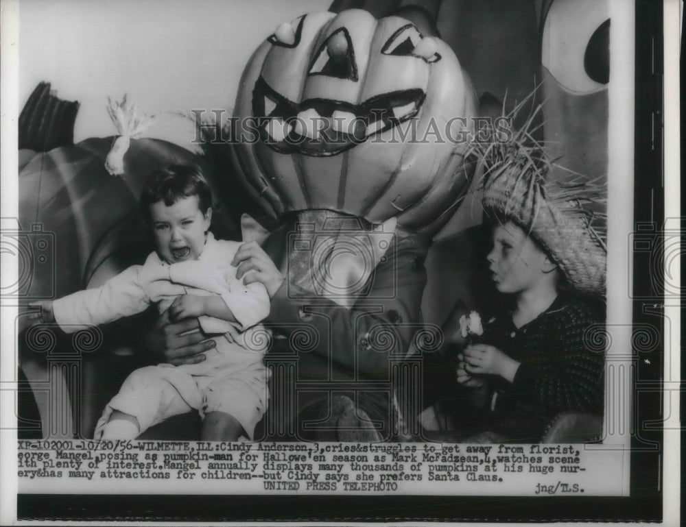 1956 Press Photo Cindy Anderson cries &amp; get away from pumpkin man - Historic Images