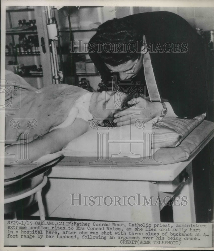 1948 Press Photo Father Condrad Wear, administers rites to Mrs. Conrad Weiss.- Historic Images