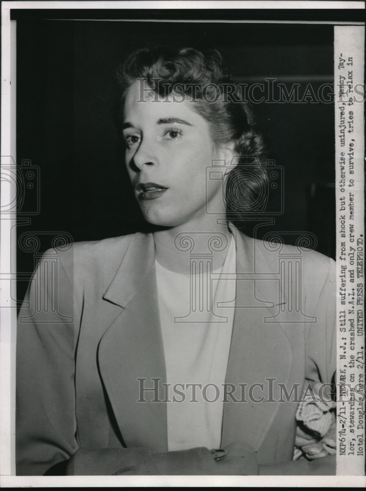 Load image into Gallery viewer, 1952 Press Photo Plane Crash Survivor Stewardess Nancy Taylor Tries To Relax
