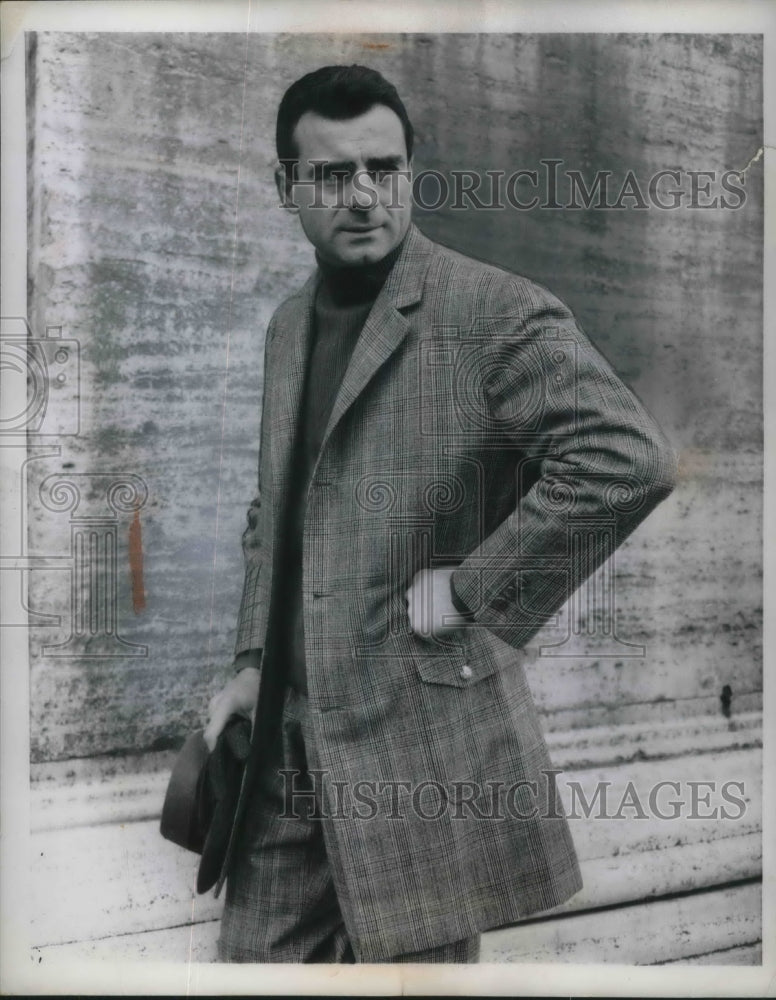 1960 Press Photo Man Model Wearing Long Cut Car Suit With High Collar Sweater