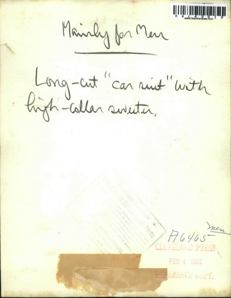 1960 Press Photo Man Model Wearing Long Cut Car Suit With High Collar Sweater