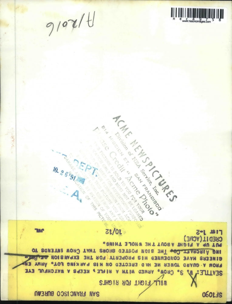 1951 Press Photo WS Crow armed w/ riffle watching parking lot that army condemnd