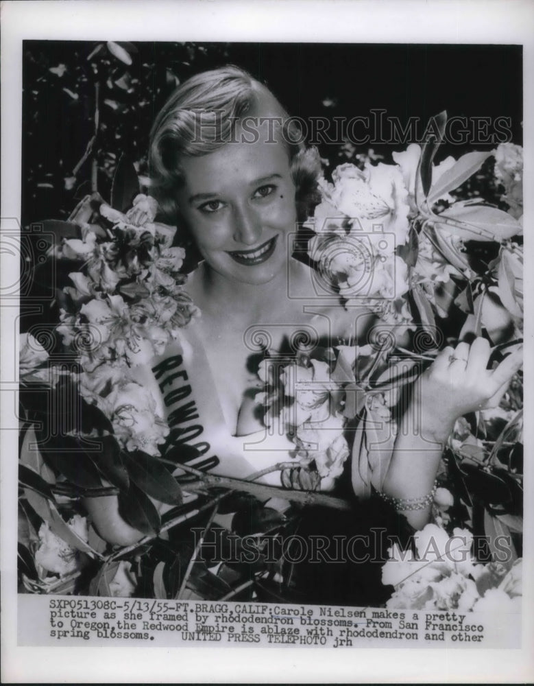 Load image into Gallery viewer, 1955 Press Photo Ft Bragg, Calif Carole Nielsen &amp; rhododendron blooms
