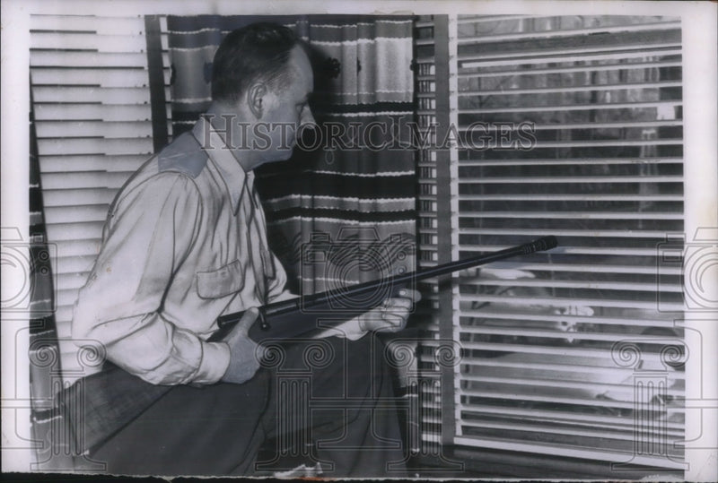 Load image into Gallery viewer, 1956 Press Photo Stephen Steven stands guard in his home from "wolf pack" gang
