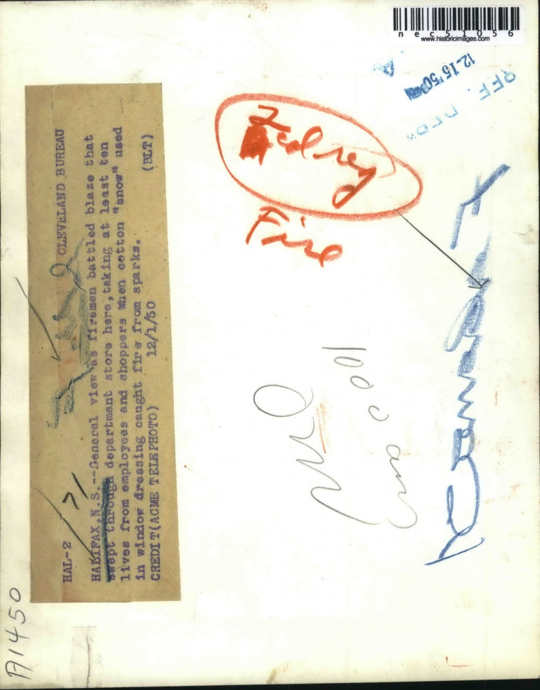 1950 Press Photo Fireman saving the lives of employees and shopper.