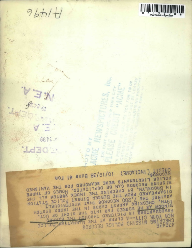 1938 Press Photo Clerk at Manhattan Police Headquarters checking missing police