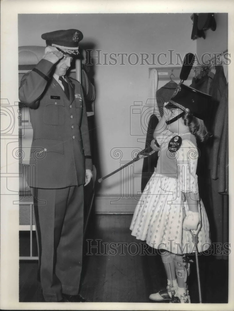 1959 Press Photo wearing a cadet hat, 8 yr old Pamela Henry exchanges salutes.- Historic Images