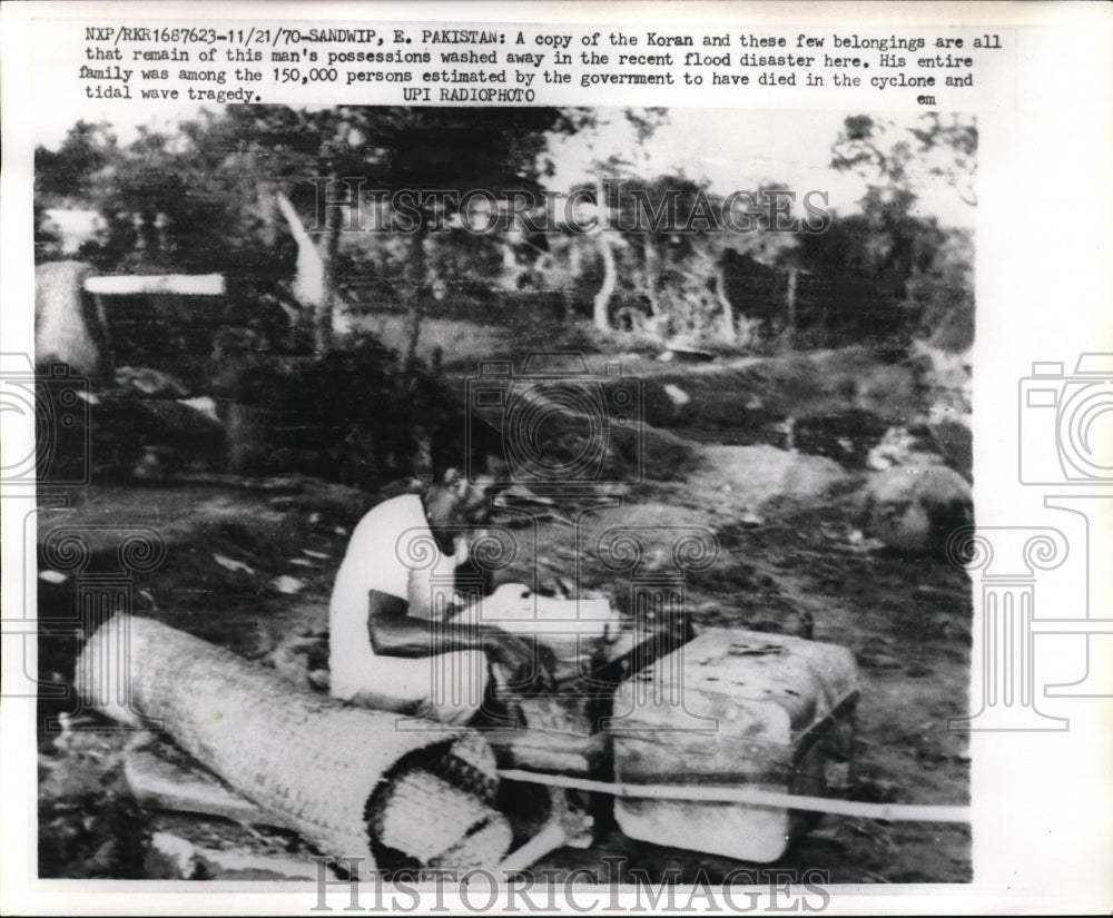 1970 Press A Copy of the Koran & few belongings are all that's left after flood