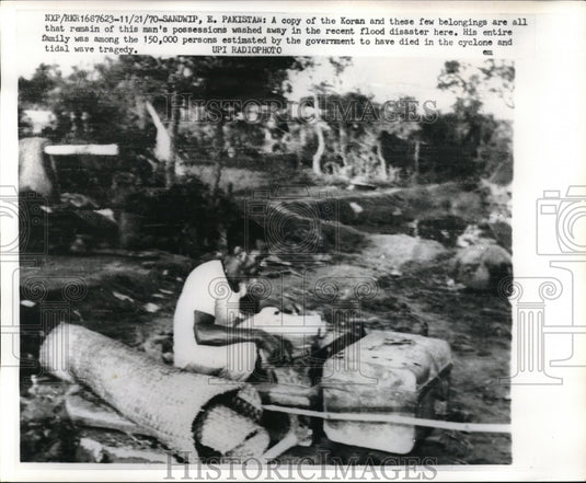 1970 Press A Copy of the Koran & few belongings are all that's left after flood