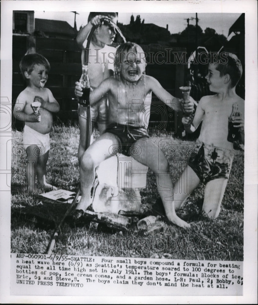 1955 Press Photo Boys Playing in Water from Garden Hose, 100 Degrees in Seattle