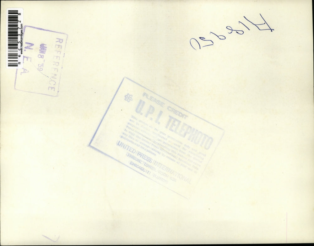 1959 Press Photo Claudia Branche cuddles up to a doll. Indianapolis Indiana