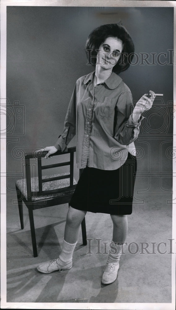 Load image into Gallery viewer, 1961 Press Photo Donna Faus Smoking a Cigarette of Maple Heights
