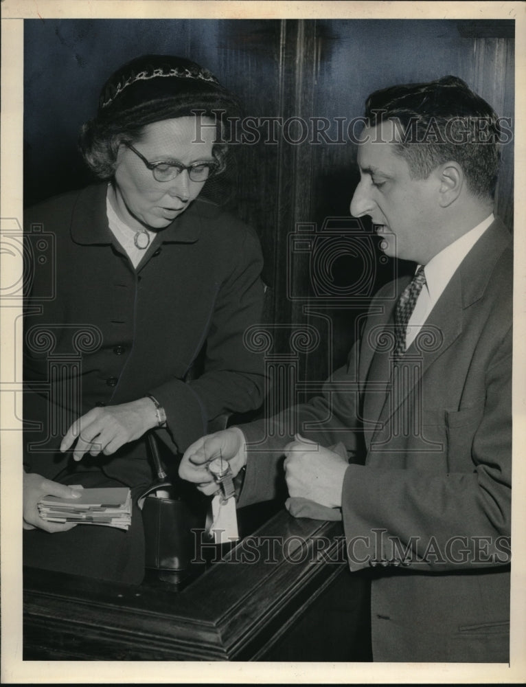 Load image into Gallery viewer, 1954 Press Photo Miss Mary Cowan looks at watch in Thomas Parrino's hand.
