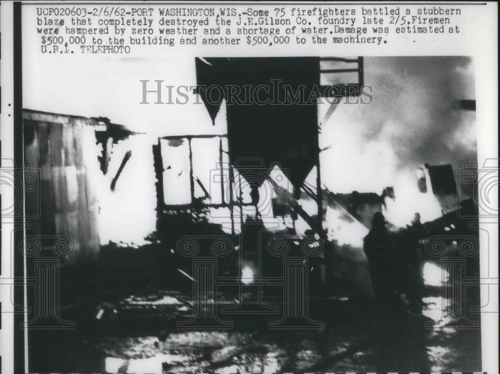 1962 Press Photo Firemen battle blaze at JE Gilson Co, Port Washington, Wis