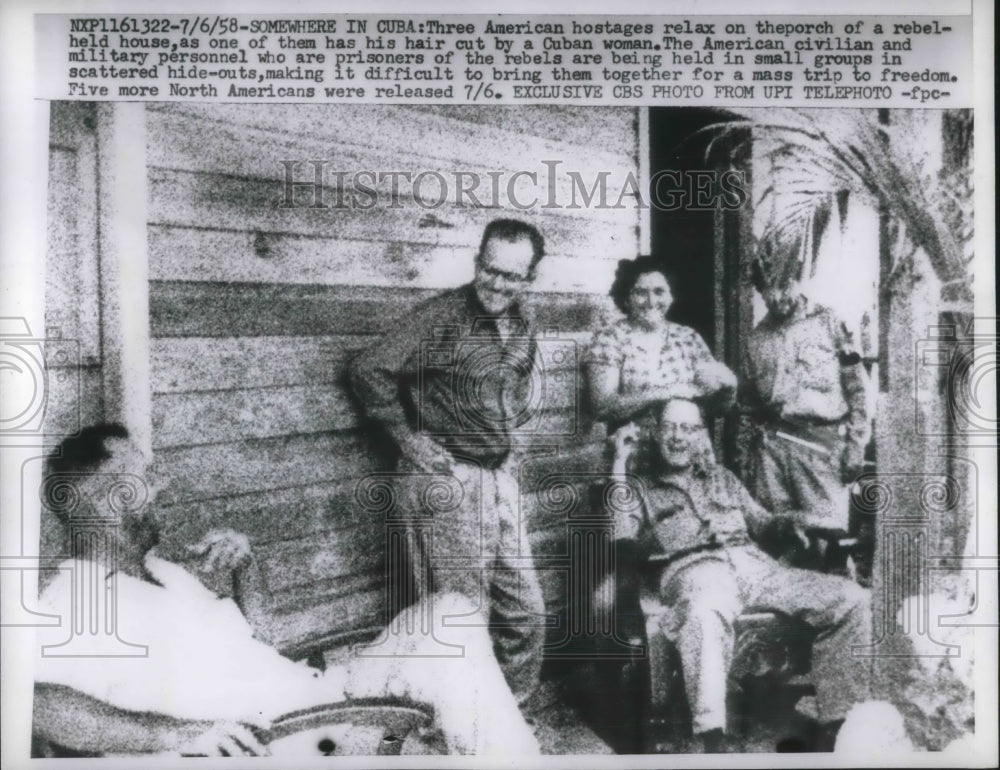 1958 Press Photo American hostages relaxes on the porch of a rebel held house