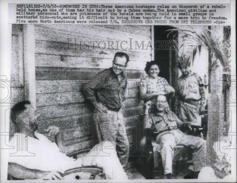 Load image into Gallery viewer, 1958 Press Photo American hostages relaxes on the porch of a rebel held house
