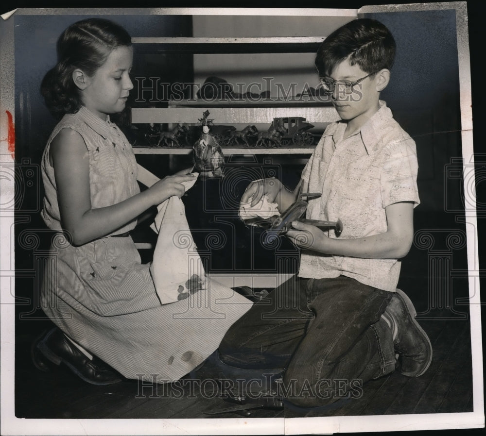 1954 Press Photo Boy and Girl Play With Toy Dolls And Planes