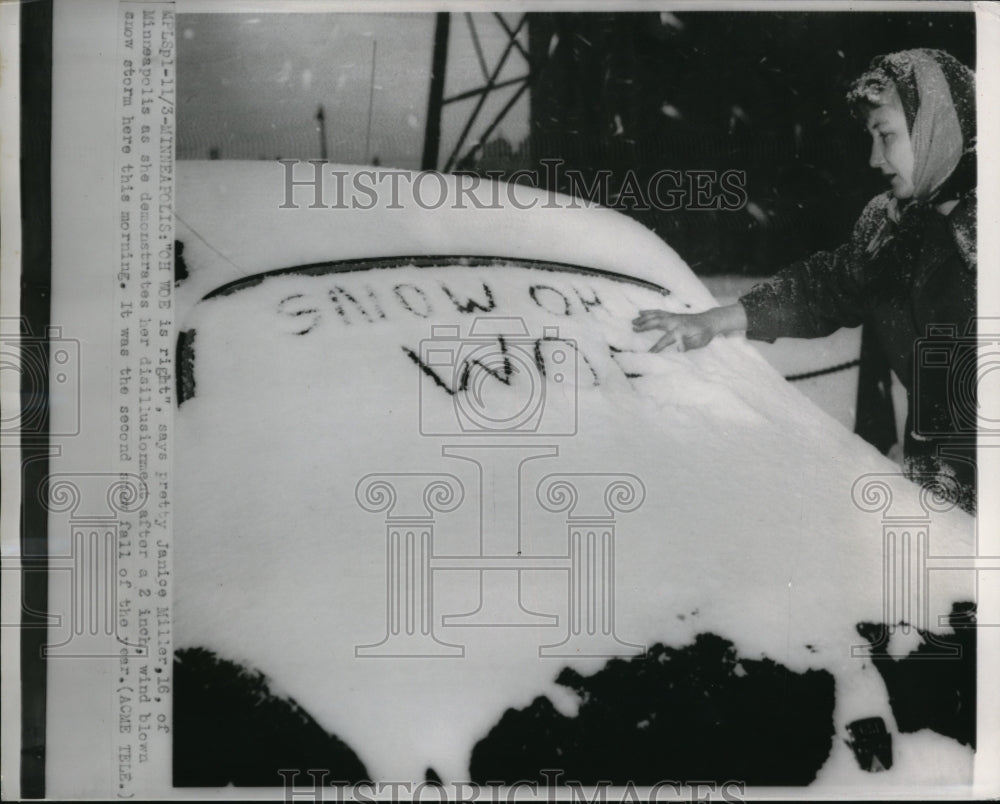 1951 Press Photo Janice Miller writing on car after a Minneapolis snow storm