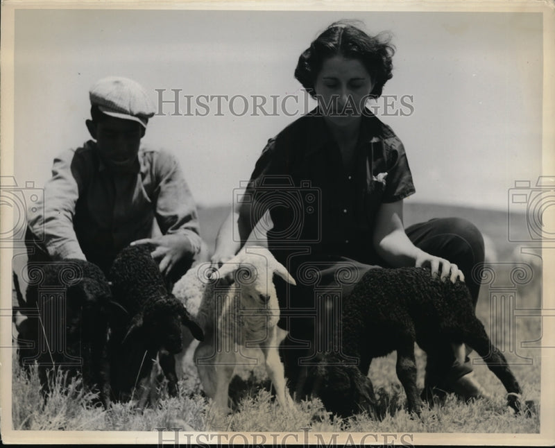 Load image into Gallery viewer, Press Photo Couple with White Lamb and Three Black Lambs in Santa Fe, New Mexico
