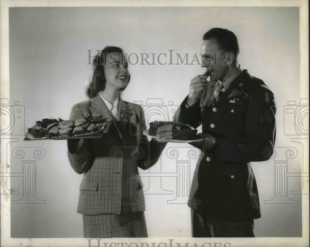 1945 Press Photo Cake and Cookies Served to U.S. Military Man