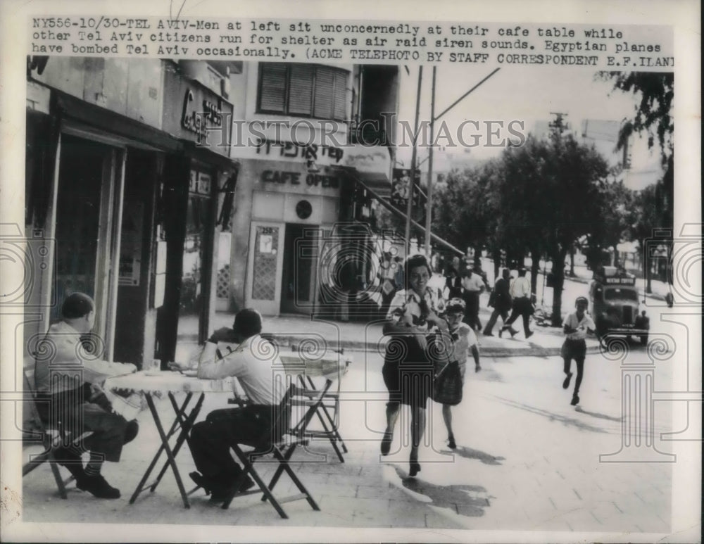 1948 Press Photo Citizens run for shelter as air raid siren sounds.