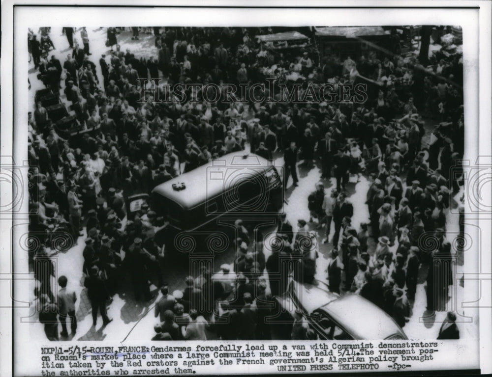 1956 Press Photo Gendarmes load up a van with communist demonstrators. France- Historic Images