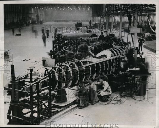 1937 Press Photo Men assembling fuselages of Planes at Austin Factory.- Historic Images