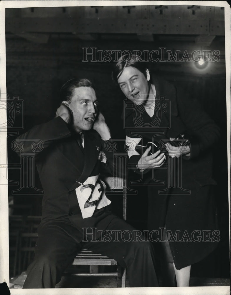 Load image into Gallery viewer, 1929 Press Photo Edward Danfield being irritated with Peggy Claoer's voice.
