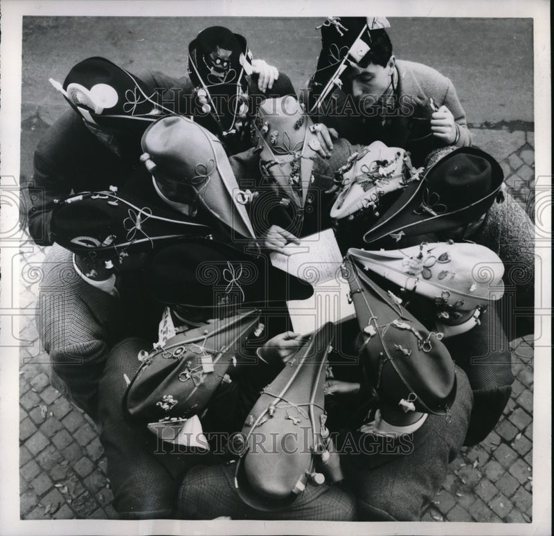 Load image into Gallery viewer, 1957 Press Photo Rome University Students Showing Headgear During Festival
