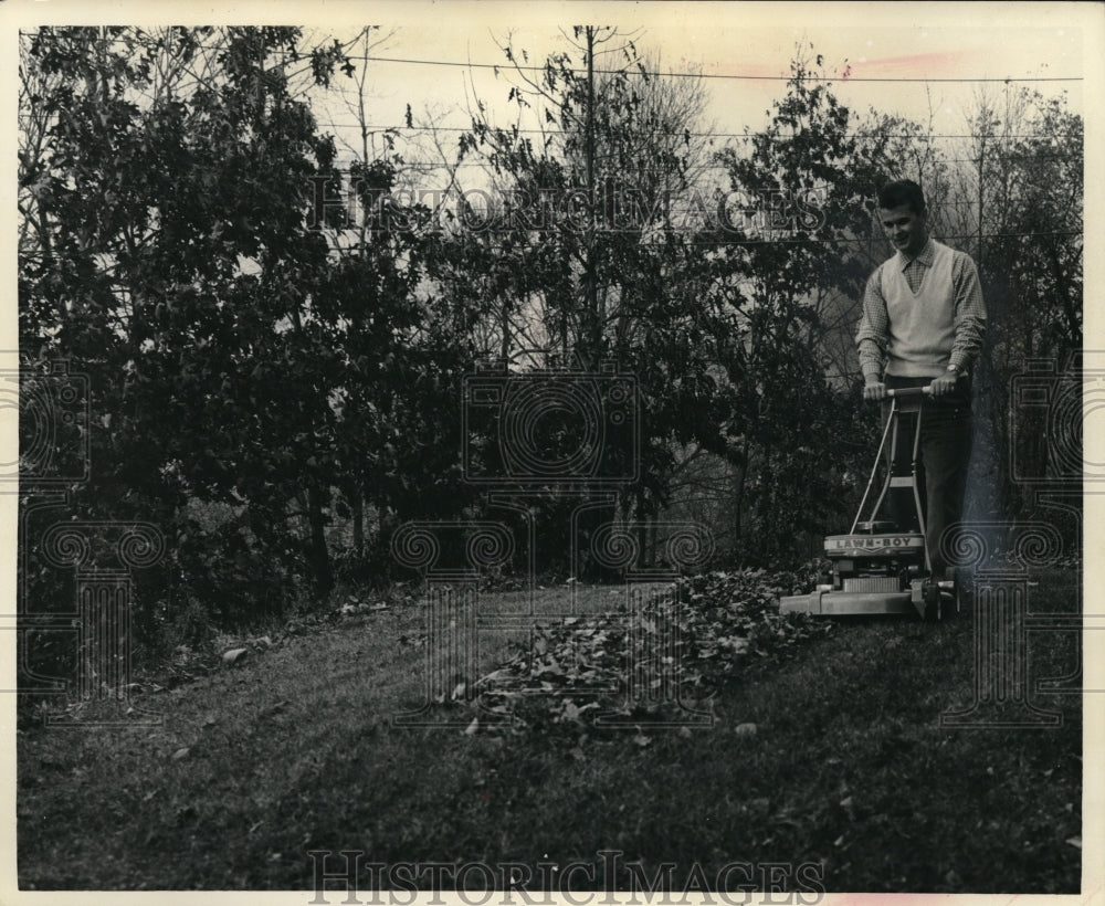 1961 Press Photo Man Mowing a Yard with Push Lawn Boy Mower