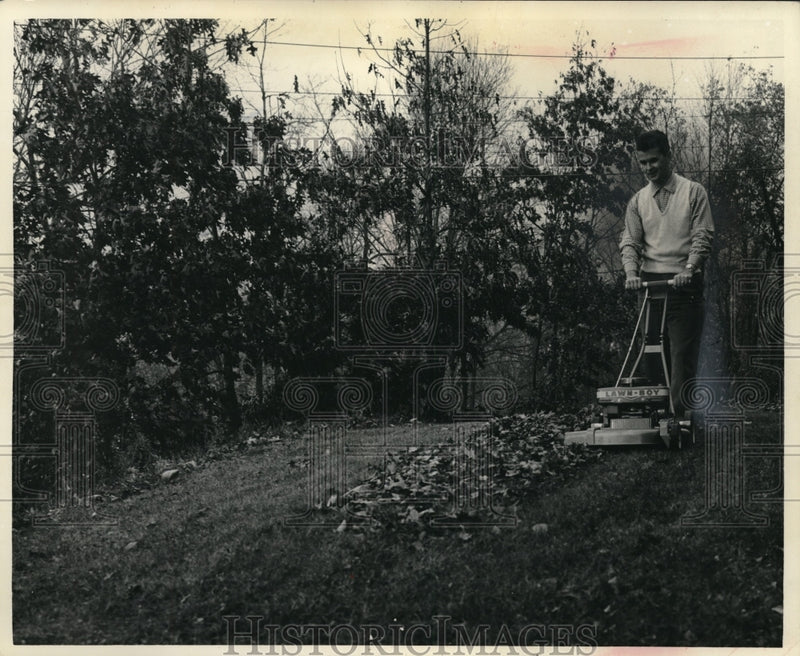 Load image into Gallery viewer, 1961 Press Photo Man Mowing a Yard with Push Lawn Boy Mower
