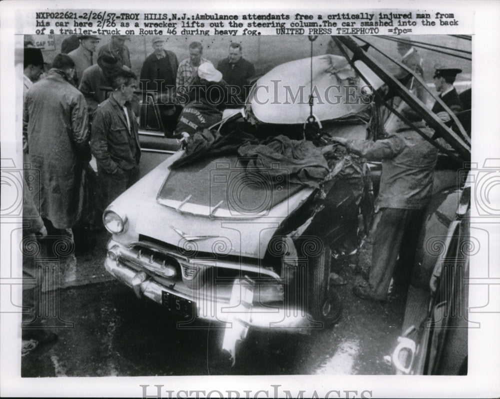 1957 Press Photo Ambulance Attendants Free injured man from Car Troy Hills NJ