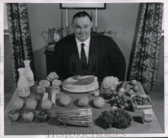 1951 Press Photo Herman Hickman with Ingredients for Dinner for two - nec65204