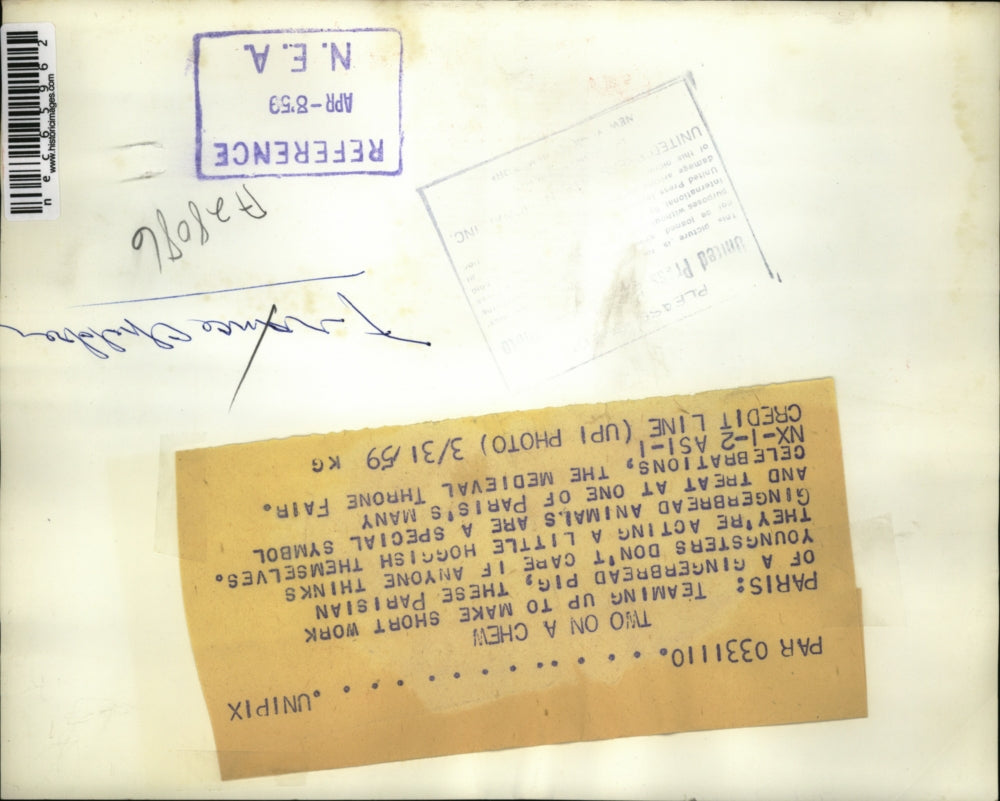 1959 Press Photo Parisian Boys Eat Gingerbread Pig - nec65962