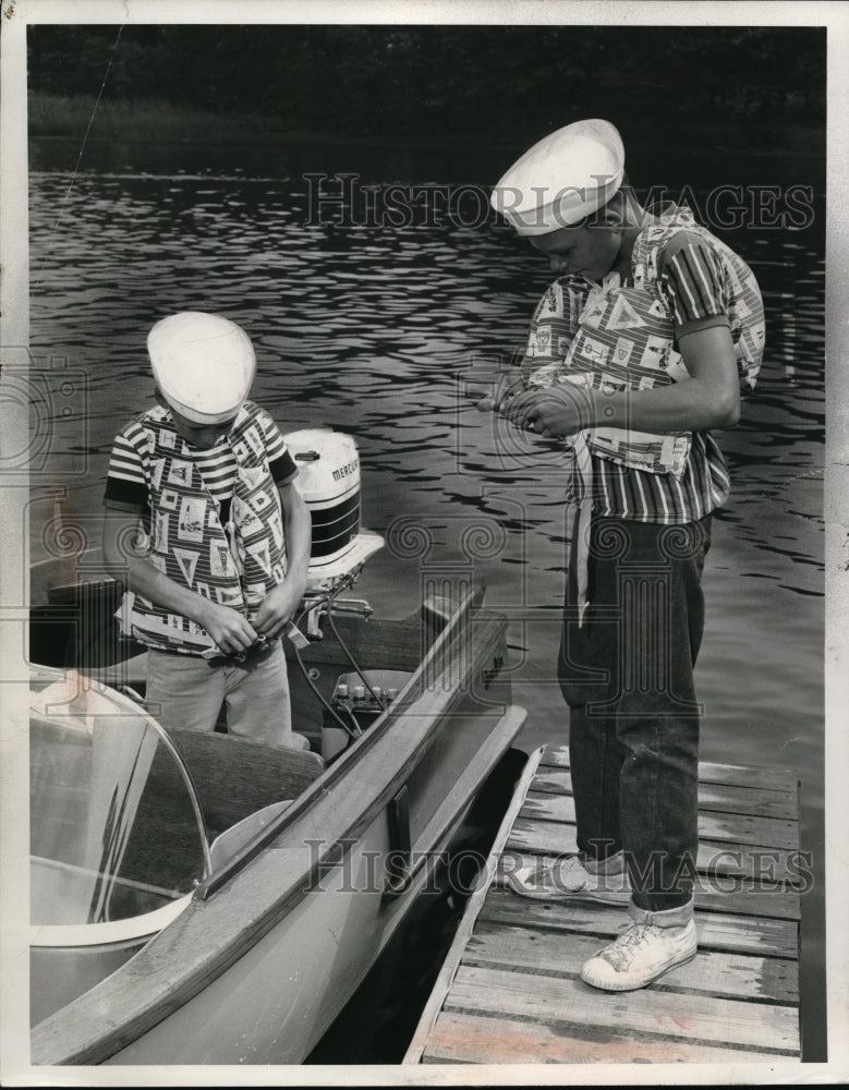 Load image into Gallery viewer, 1960 Press Photo Children put on life jackets for a boating excursion
