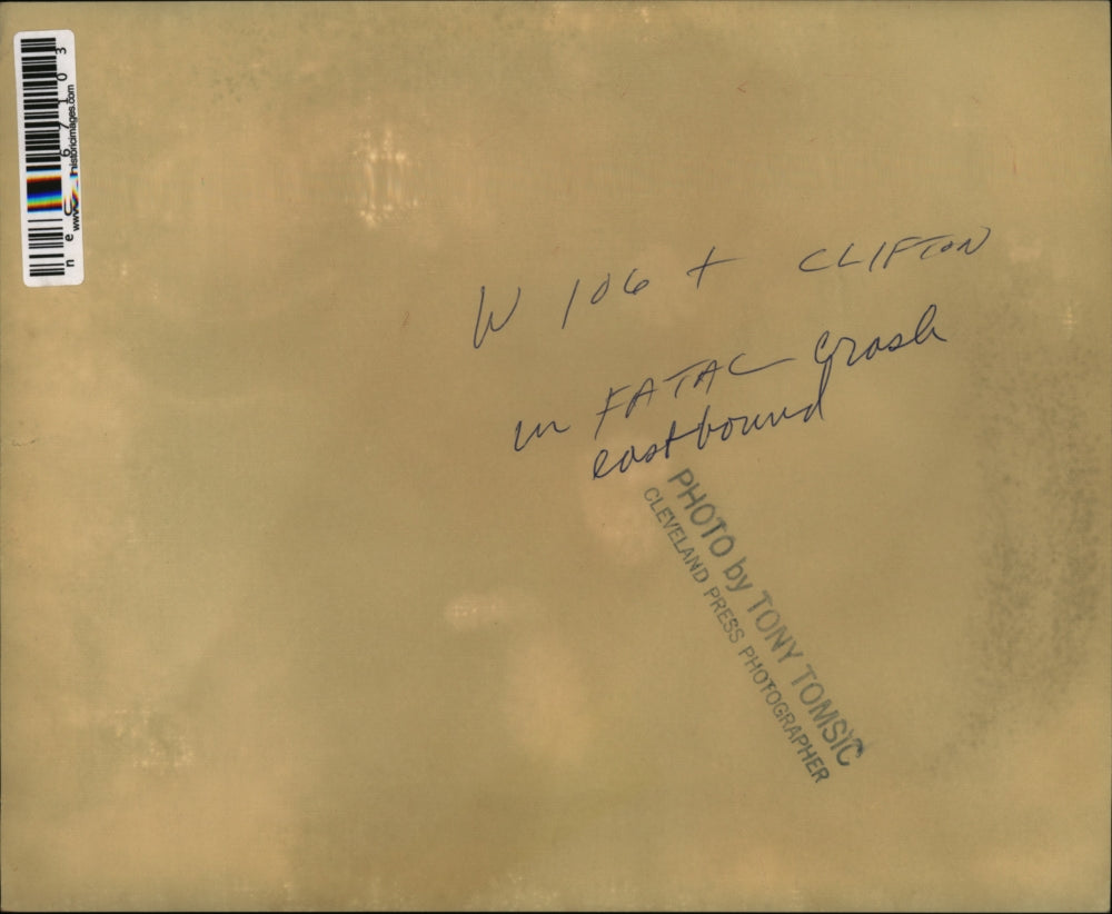 Press Photo Wrecked car behind a tow truck at accident scene - nec67103