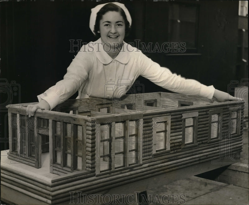 Load image into Gallery viewer, 1936 Press Photo Nurse June Eddy Looks At Model Of New Hospital
