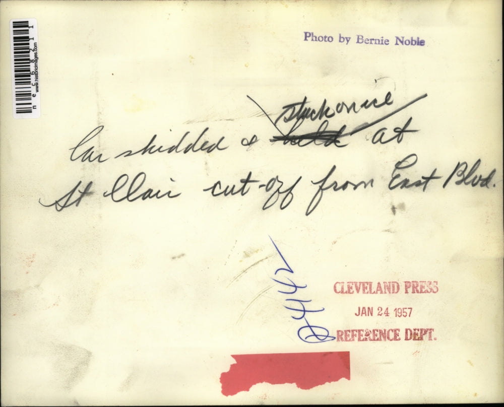 1957 Press Photo Car Skidded On Ice St Clair Cut Off From East Blvd