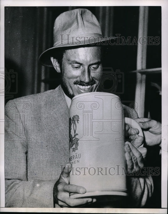 1953 Press Photo Dr. Karl Herrigkoffer holding a huge drink - nec68442