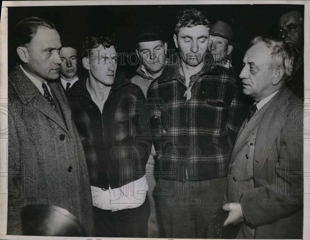 1947 Press Photo 2 men surrenders after raping a student and killing his brother