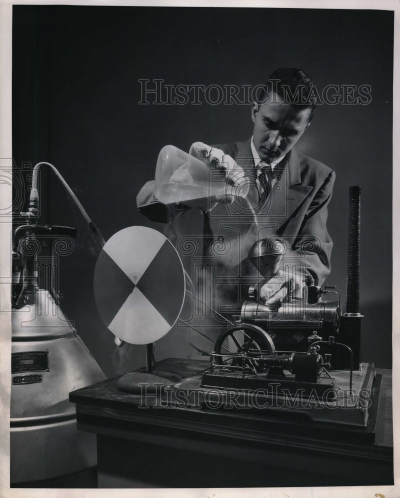 Load image into Gallery viewer, 1952 Press Photo Westinghouse reporter Robert Dollinson with liquid nitrogen
